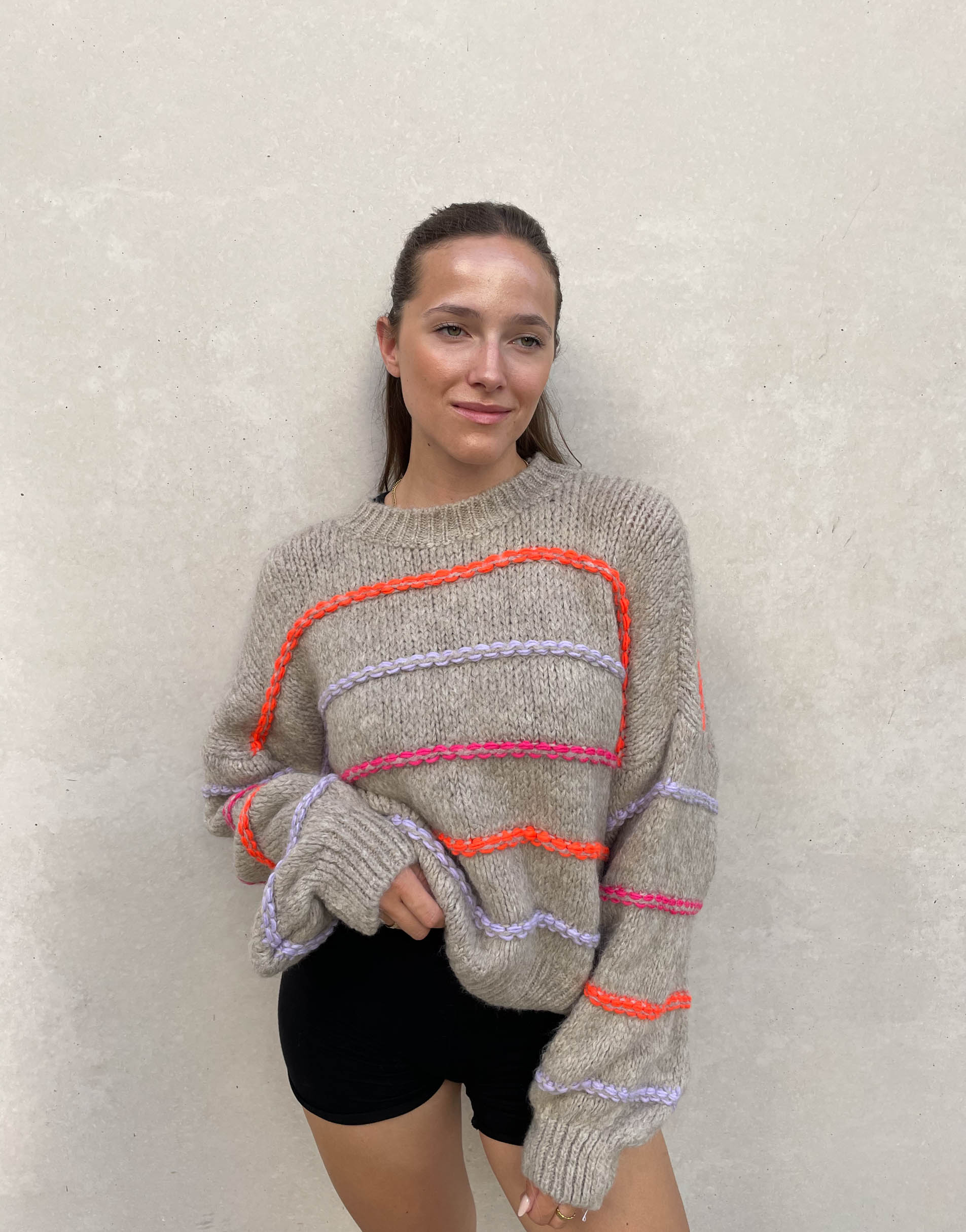 Oversized sweater with neon stitching