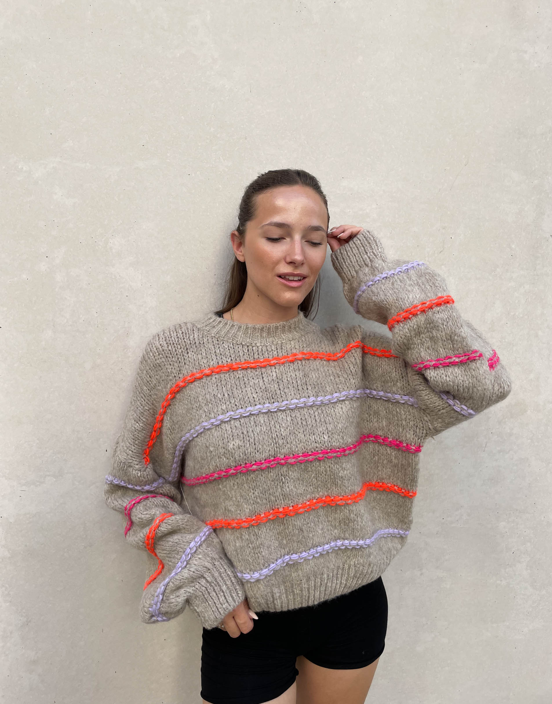 Oversized sweater with neon stitching