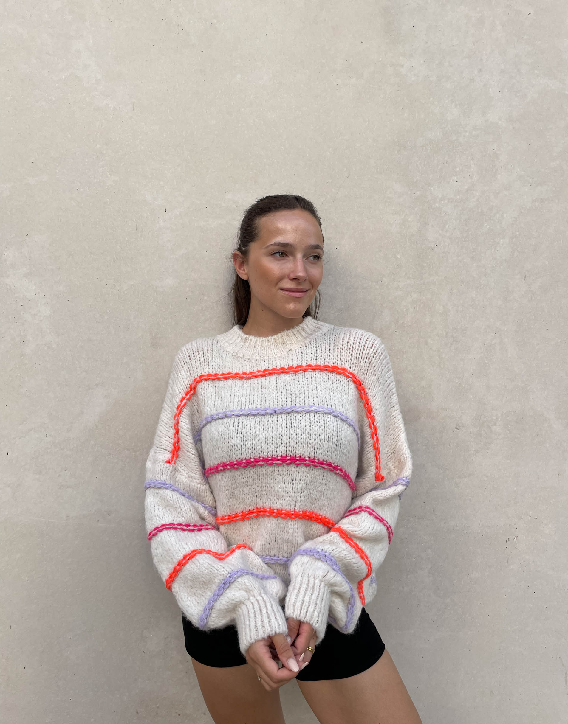 Oversized sweater with neon stitching