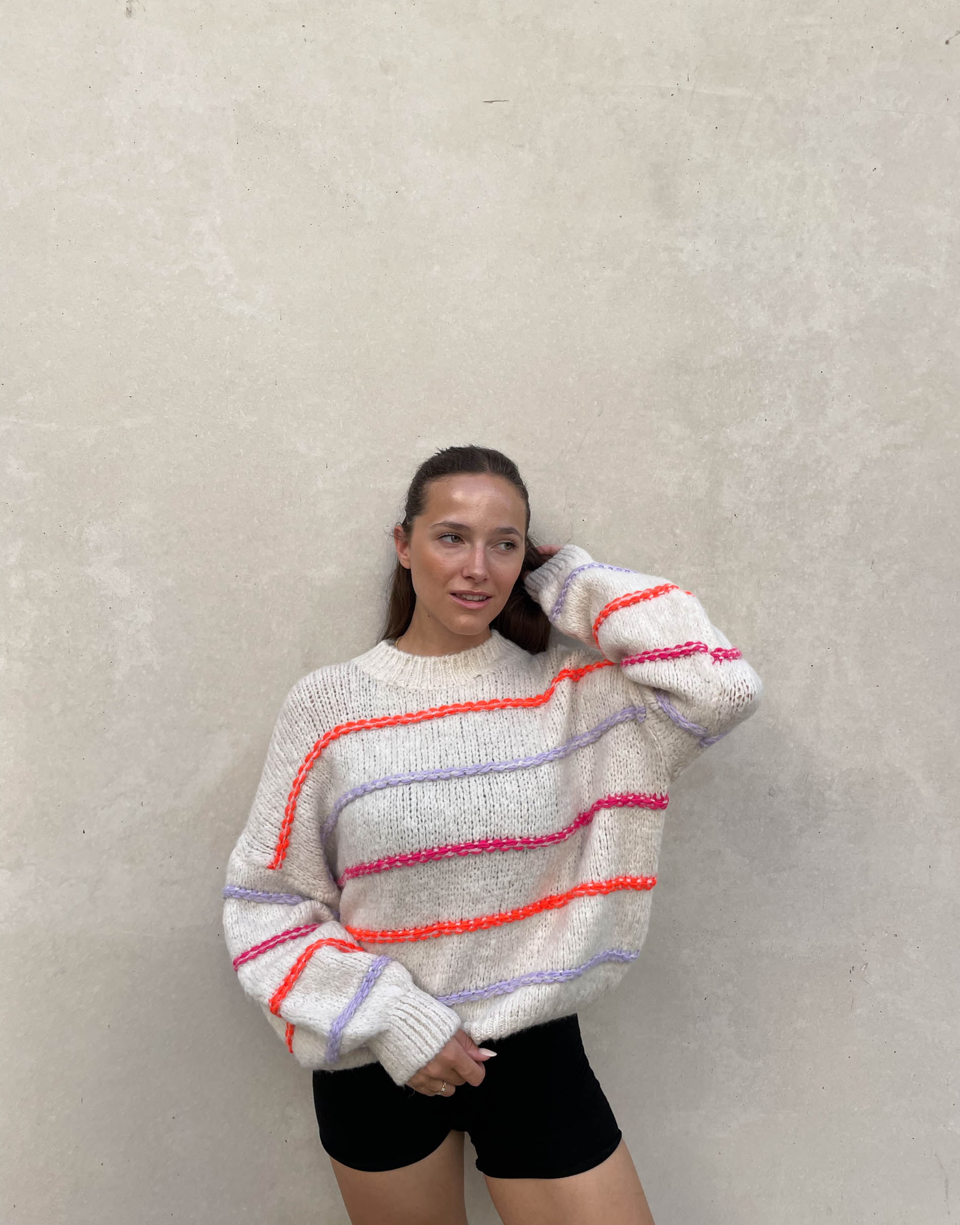 Oversized sweater with neon stitching